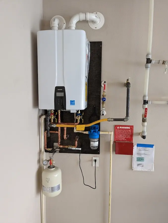 Professional plumber installing copper piping in a Lake Darby home