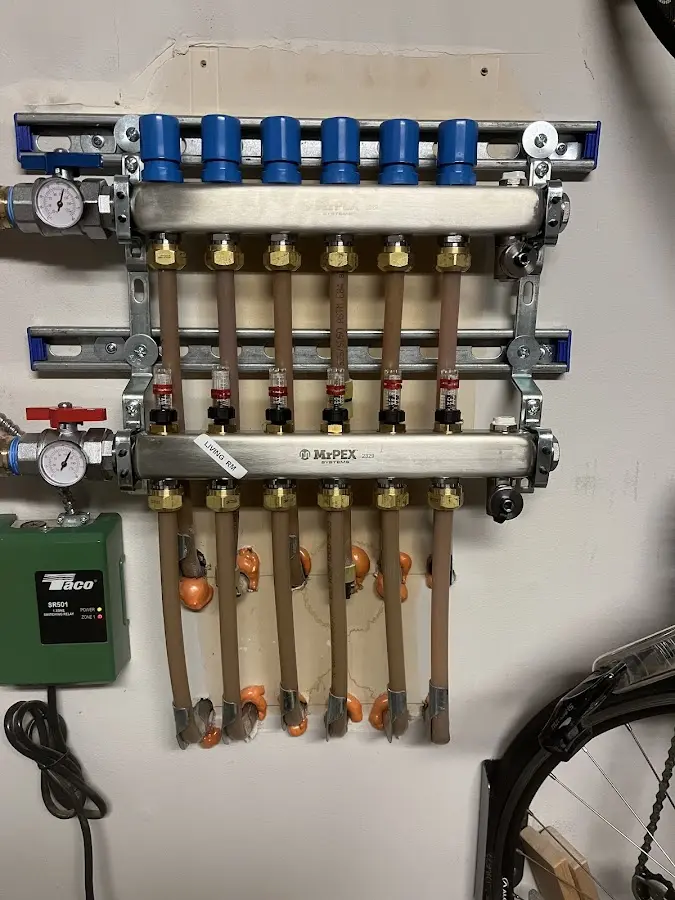 Plumber performing Water Heater Repair at a residential property in Lake Darby